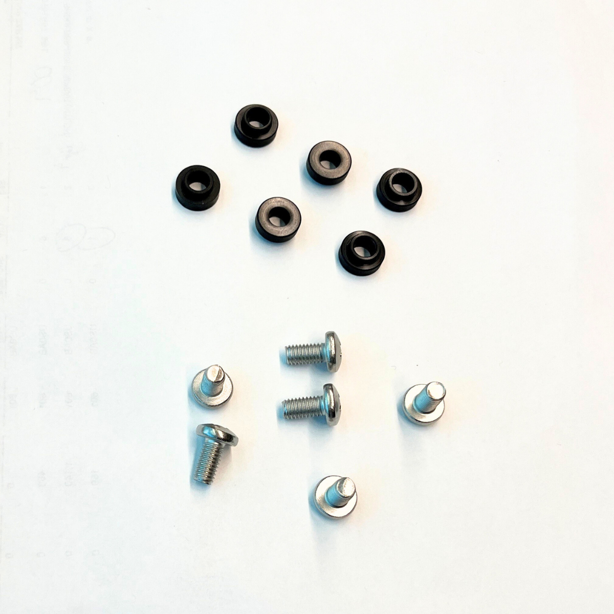 Collection of bump bar screws and bolts on a white background